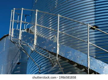 A Close Up Detail Photo Of A Shiny Metal Grain Storage Bin In Western Canada