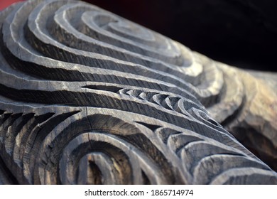 Close up detail of a rough wooden carving