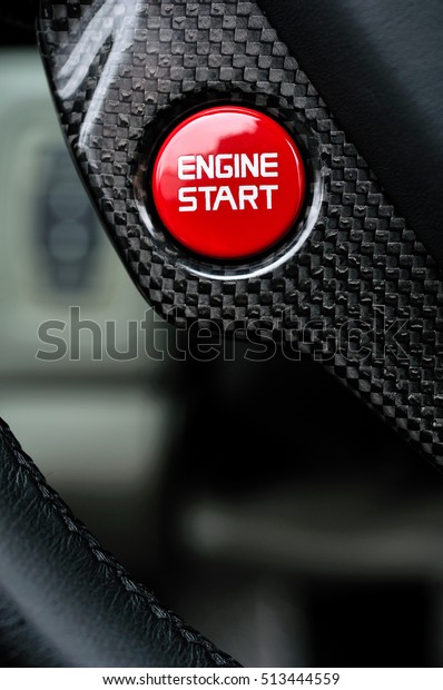 Close Detail of the start stop button in a luxury\
Performance Car 