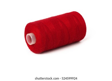 Close up detail still life of dark red spool of thread isolated on white background copy space - concept fashion DIY clothing sewing handicraft design handmade needlework tradition