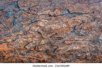 Close up detail of the surface of a rusty pipe destroyed by corrosion. 