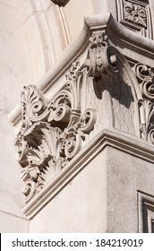 Close Up Detail View Of An Old Stone Building Column In The City Of London With Multiple Intricate Classic Architecture Design Features And Decorative Carvings. Close Up Building Corner Detail.