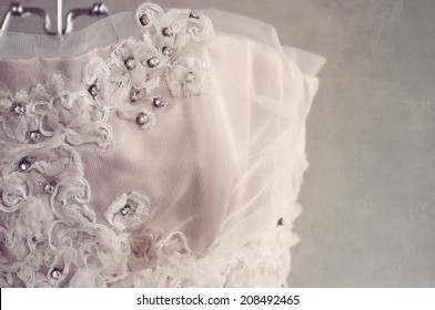 Close Up Detail Of Vintage Style Wedding Dress On A Hanger