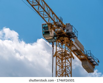 Close up details with a cabin control of a construction crane.Turret Slewing Crane against blue sky