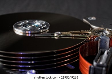 Close up details of computer hard disc drive platters and mechanism.