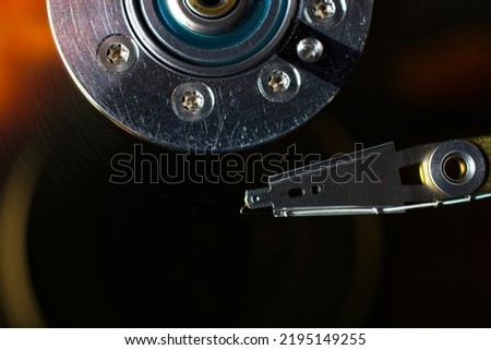 Close up details of computer hard disc drive platters and mechanism. Top down view of read-write head
