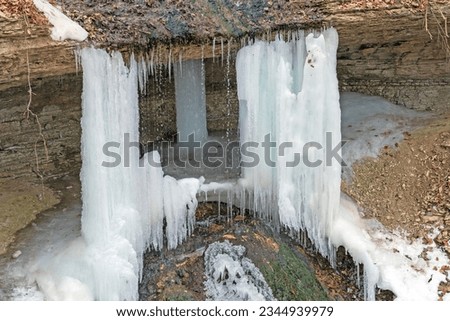 Close Details of a Frozen Bridalveil Waterfall in Pikes Peak State Park in Iowa