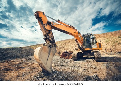 Close up details of industrial excavator working on construction site - Shutterstock ID 680854879