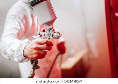 Close Up Details Of Industrial Worker, Mechanic Engineer Painter Painting A Car