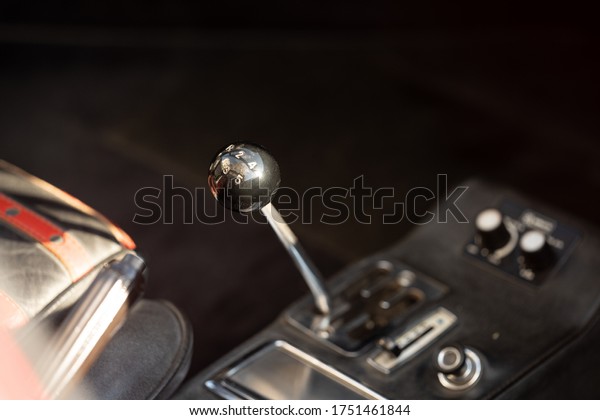 Close\
up details shot : gear shift knob in vintage\
car.