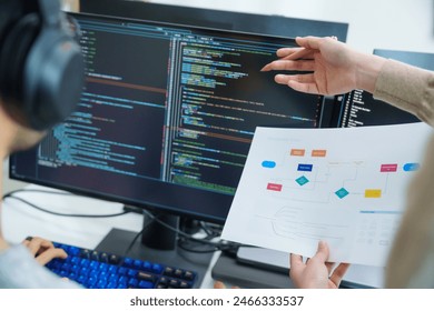 close up developer discussion about app flowchart coding at desk in modern office