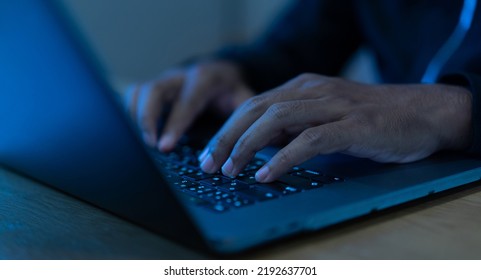 close up developer man hand type keyboard input code for register system software or unlock password on laptop in dark operation office room for cyber security technology and work from home concept - Powered by Shutterstock