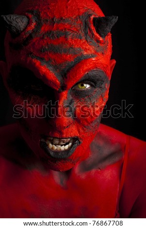 Close up of a devil. Low key lighting.
