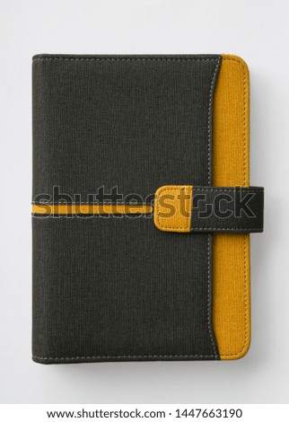 close diary, planner or notebook. Office and business supplies for lists, reminders, schedules or agendas.