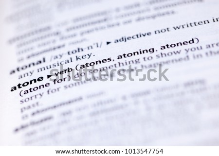 Close up to the dictionary definition of Atone