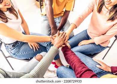 Close Up Of Different People Sitting On Chairs In Circle Holding Hands Together - Multiracial Community Support And Help Each Other - Addiction Treatment Rehab, Teamwork And Unity Concept