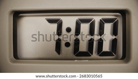 Close Up of Digital Clock with Bright Display Showing Precise Time in Morning. Modern Electronic Timekeeping Device. Contemporary Design Element of Interior. Time Management, Punctuality, Lifestyle.