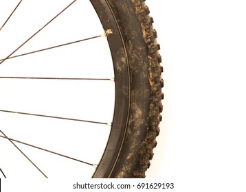 Close Up Of A Dirty Mountain Bike Tyre On A White Background On A White Background Corner