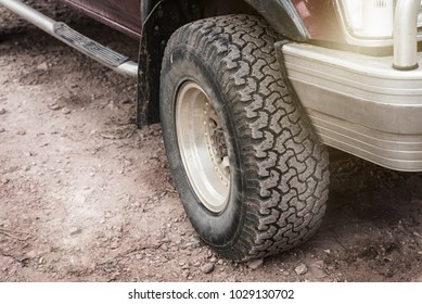 Close Up Dirty Off-road Car Wheel.