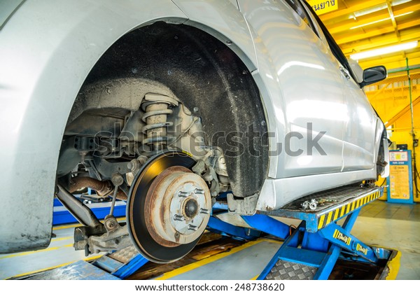 Close up of disk brake on car in process of damaged.-\
Brake job 