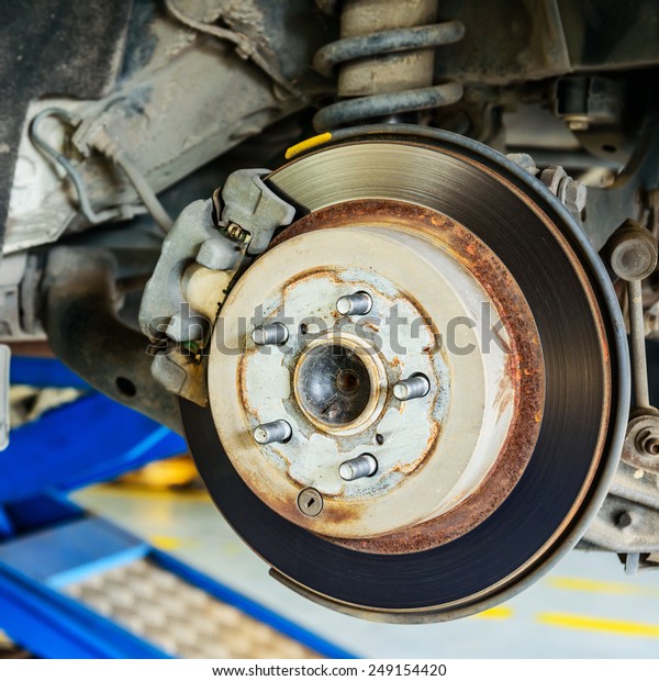 Close up of disk brake on car in process of damaged.-
Brake job 