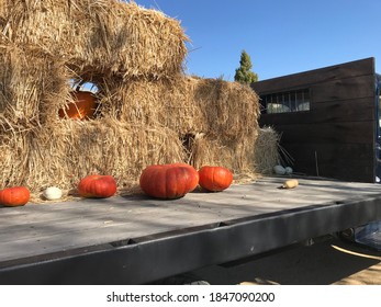 Close Up Display Of Pumpkins With Straw Bales On Old Truck Bed