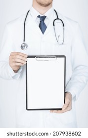 Close Up Of Doctor Holding Blank White Paper