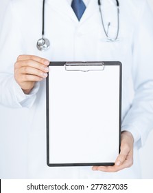 Close Up Of Doctor Holding Blank White Paper