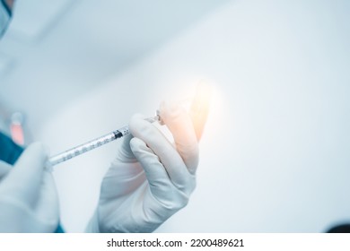 Close Up Doctor, Scientists, Researcher Hands Wearing Medical Surgical Glove Hold Vaccine Vial Syringe With COVID-19 Coronavirus, Flu, Influenza Vaccine. Vaccination, Medical,diseases,science Concept