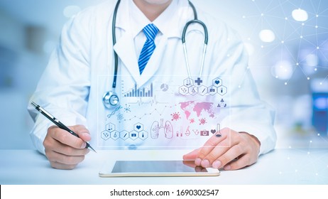 Close Up Of Doctor Is Showing Medical Analytics Data Of Coronavirus (Covid-19), Medical Technology Concept