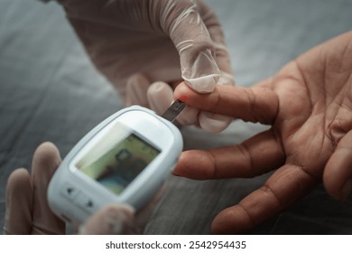 close up doctor using glucometer checking blood sugar level of senior woman. diabetes concept