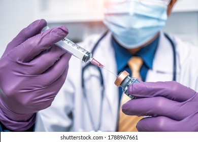 Close up doctor's hand in purple gloves holding medicine bottle flu, coronavirus, covid-19 vaccine disease preparing for human clinical trials vaccination shot, medicine and drug concept.
 - Powered by Shutterstock