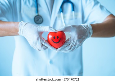 Close Up Of Doctor's Hands Making Heart Shape. Close-up Of Unknown Female Doctor With Stethoscope .