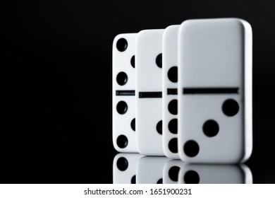 Close up of Domino pieces on black background - Powered by Shutterstock