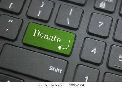 Close Up Of Donate Button On Computer Keyboard