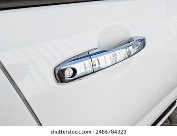 Close Up of door handle in white car of toyota raize, Exterior design of a new car