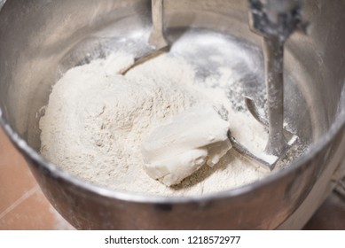 Close Up Of Dough In Electric Bakery Mixer