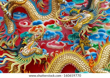 The close up of the dragon's fight on the red wall.