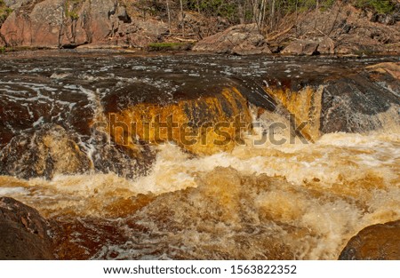 Close up of a Dramatic Fall in the Spring at the Red Granites in Copper River State Park in Wisconsin