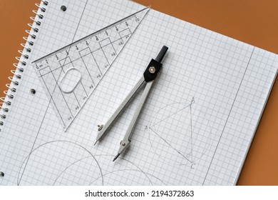 Close up drawing Compass and ruler on the open notebook. Mathematical accessories, back to school background - Powered by Shutterstock - Get 15% off with code: PIKWIZARD15