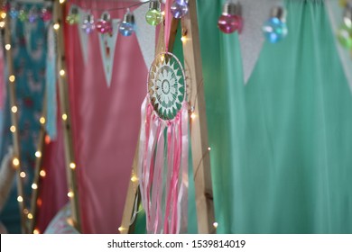 A Close Up Of A Dream Catcher On Teepees At A Girls Sleepover Party. 