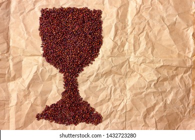 Close Up With Dried Grape Seeds Laid Out On Paper In The Form Of A Glass. Close-up Raw Grape Seeds Surface As A Background With Copy Space.