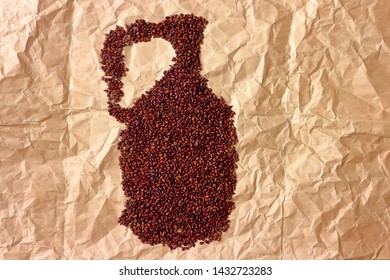 Close Up With Dried Grape Seeds Laid Out On Paper In The Form Of Jug. Close-up Raw Grape Seeds Surface As A Background With Copy Space.