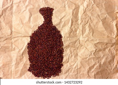 Close Up With Dried Grape Seeds Laid Out On Paper In The Form Of Jug. Close-up Raw Grape Seeds Surface As A Background With Copy Space.