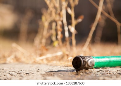 Close Up Of Of Dripping Garden Hose Pipe