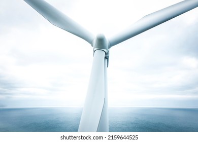 Close Up Drone Image Of Wind Turbine In The Ocean.