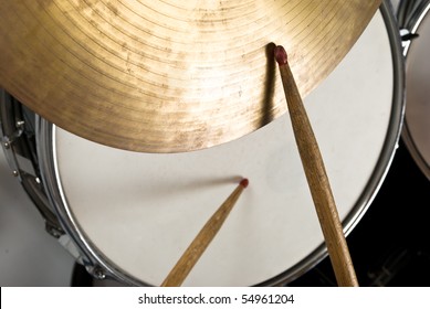 Close Up Of Drum Kit With Cymbal And Drumsticks