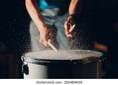 Close Up Drum Sticks Drumming Hit Beat Rhythm On Drum Surface With Splash Water Drops