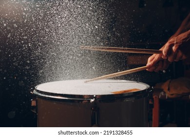 Close Up Drum Sticks Drumming Hit Beat Rhythm On Drum Surface With Splash Water Drops