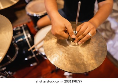 Close Up Of A Drummer's Hand Setting Up Hi-hat Clutch Cymbals Before Use